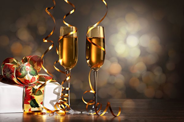Фотография Рождество Шампанское Лента Бокалы Праздники 600x399 Новый год Игристое вино бокал ленточка
